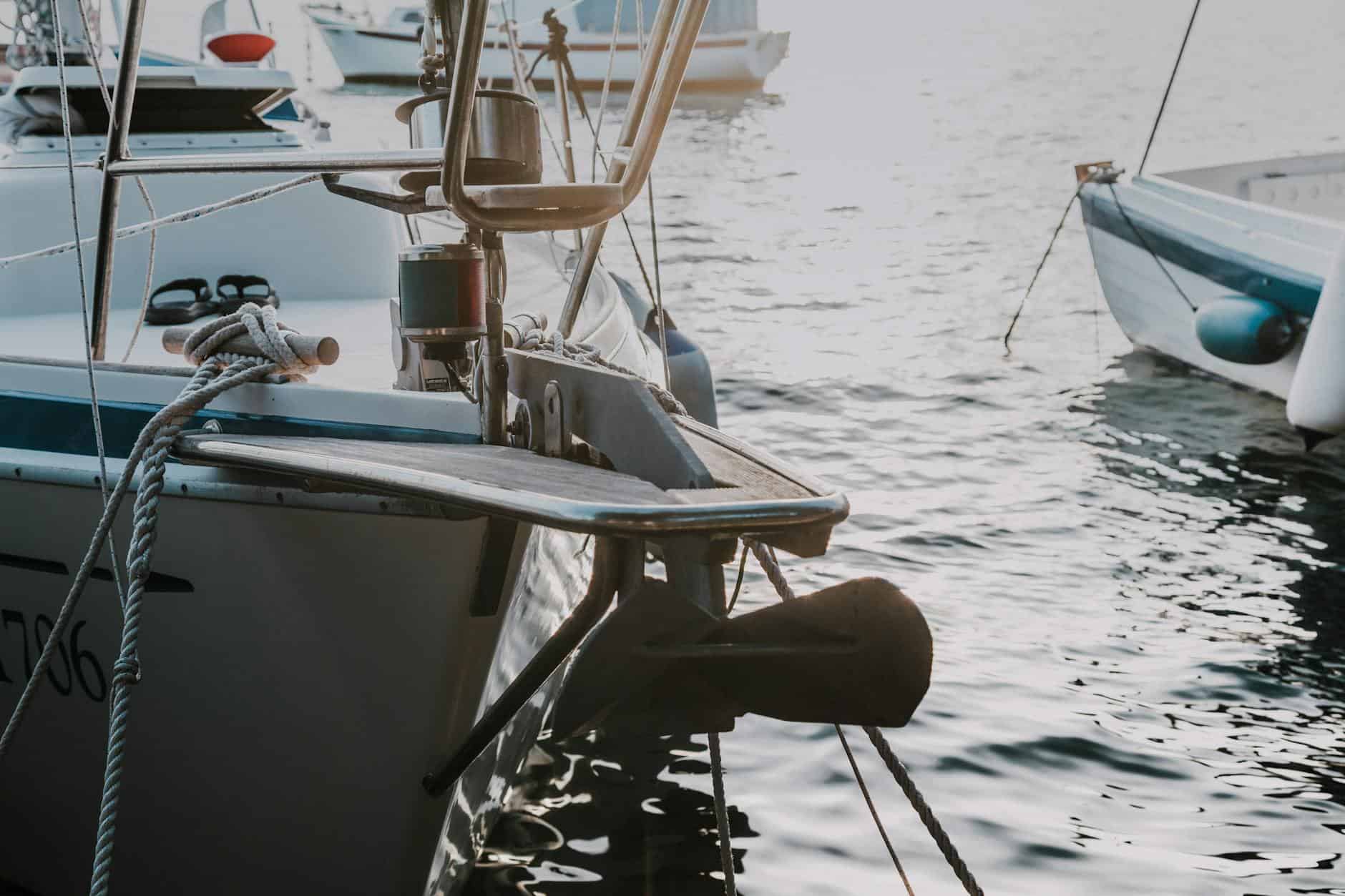 View of sailing boats anchor in home postion on deck. 