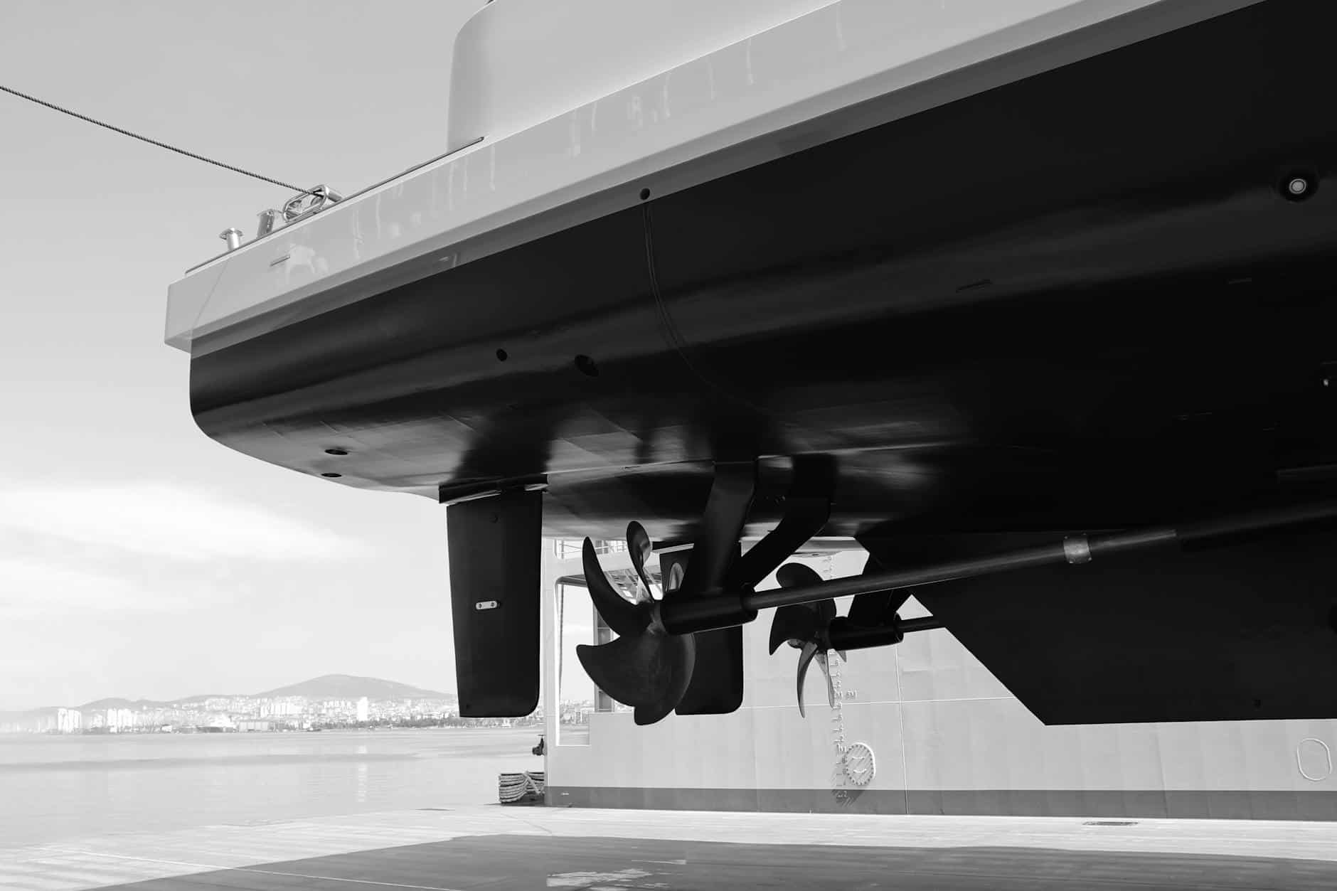 Underneath of yacht, showing propellers and clean antifouling paint. 
