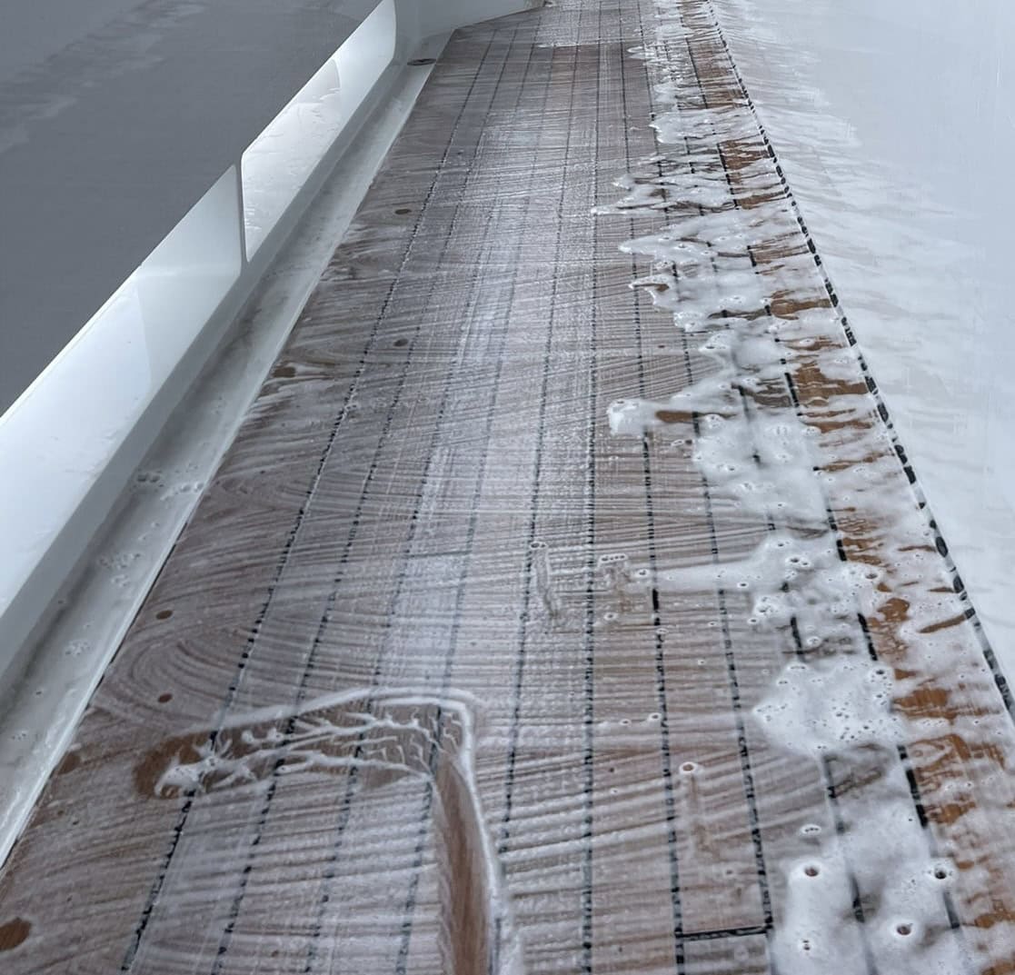 Teak cleaners being used on a teak deck. 