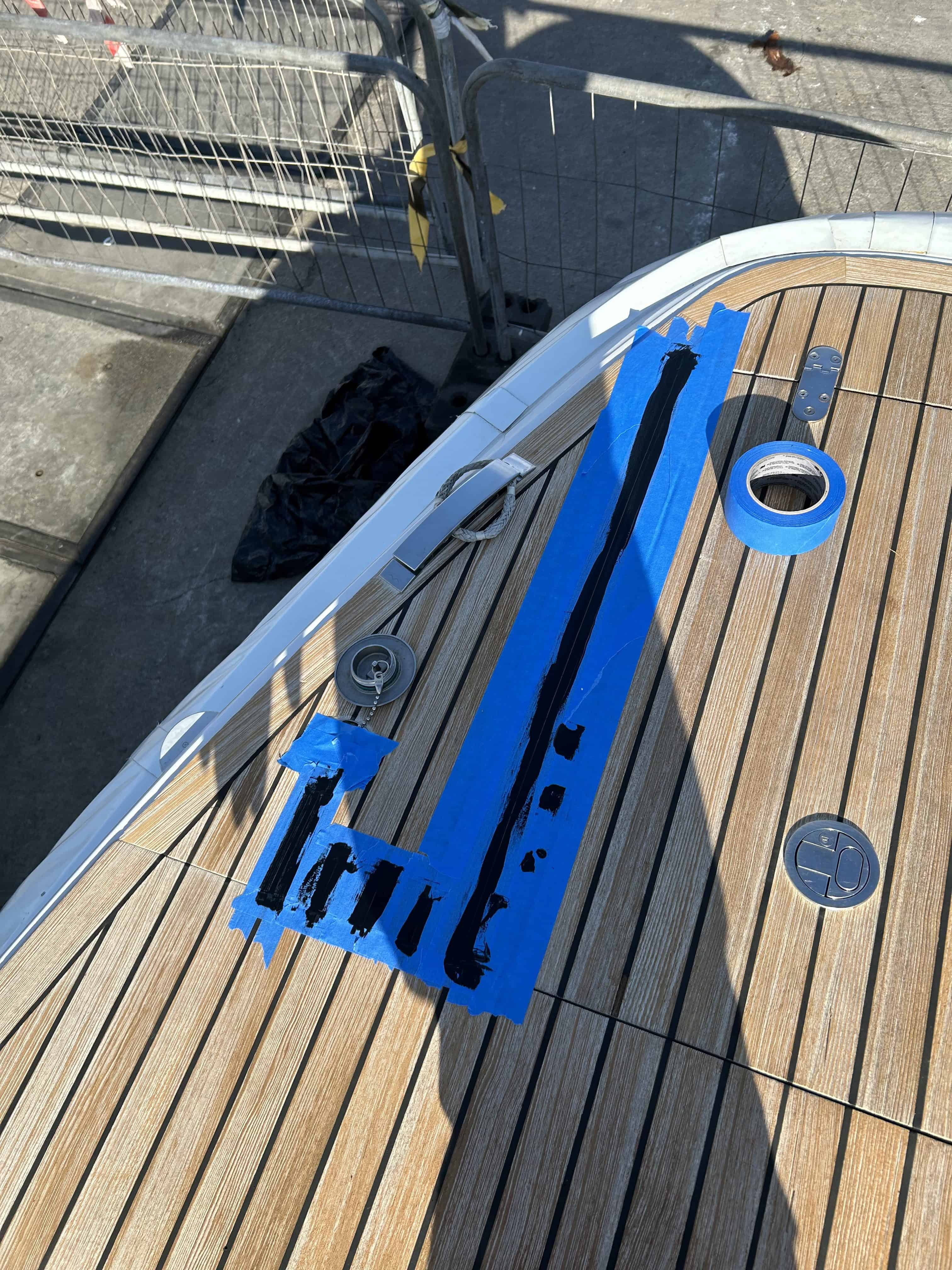 Teak deck caulking repairs being completed. 