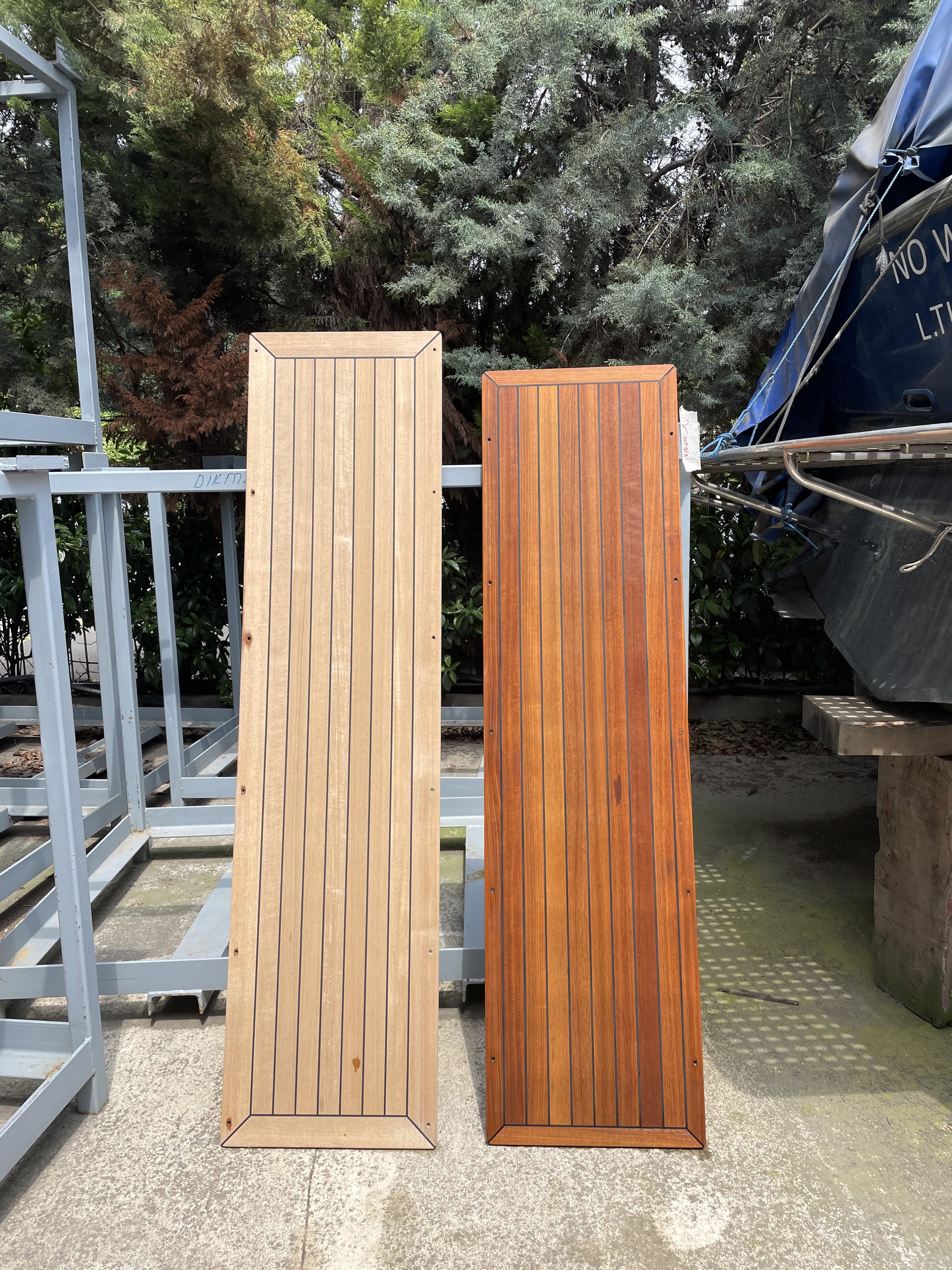 Dark and light teak panels stood upright.