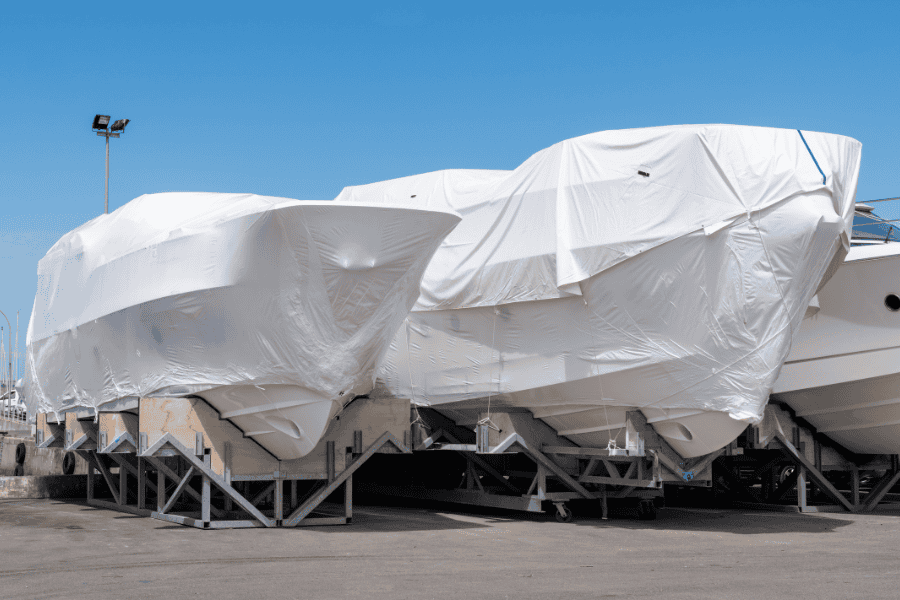 Sun protection for boats during maintenance, with boat covers protecting vessels from UV damage and weather elements at the yacht storage facility.