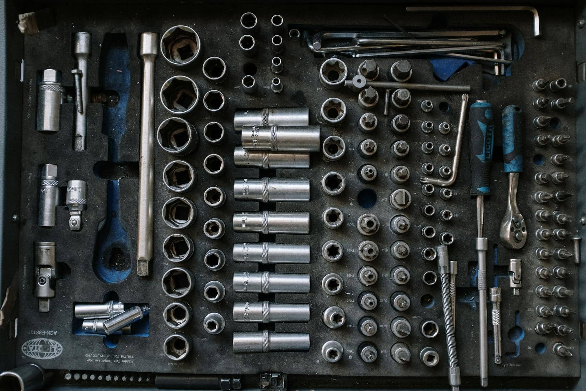 silver and blue metal boat tools. Ratchet and socket set. 