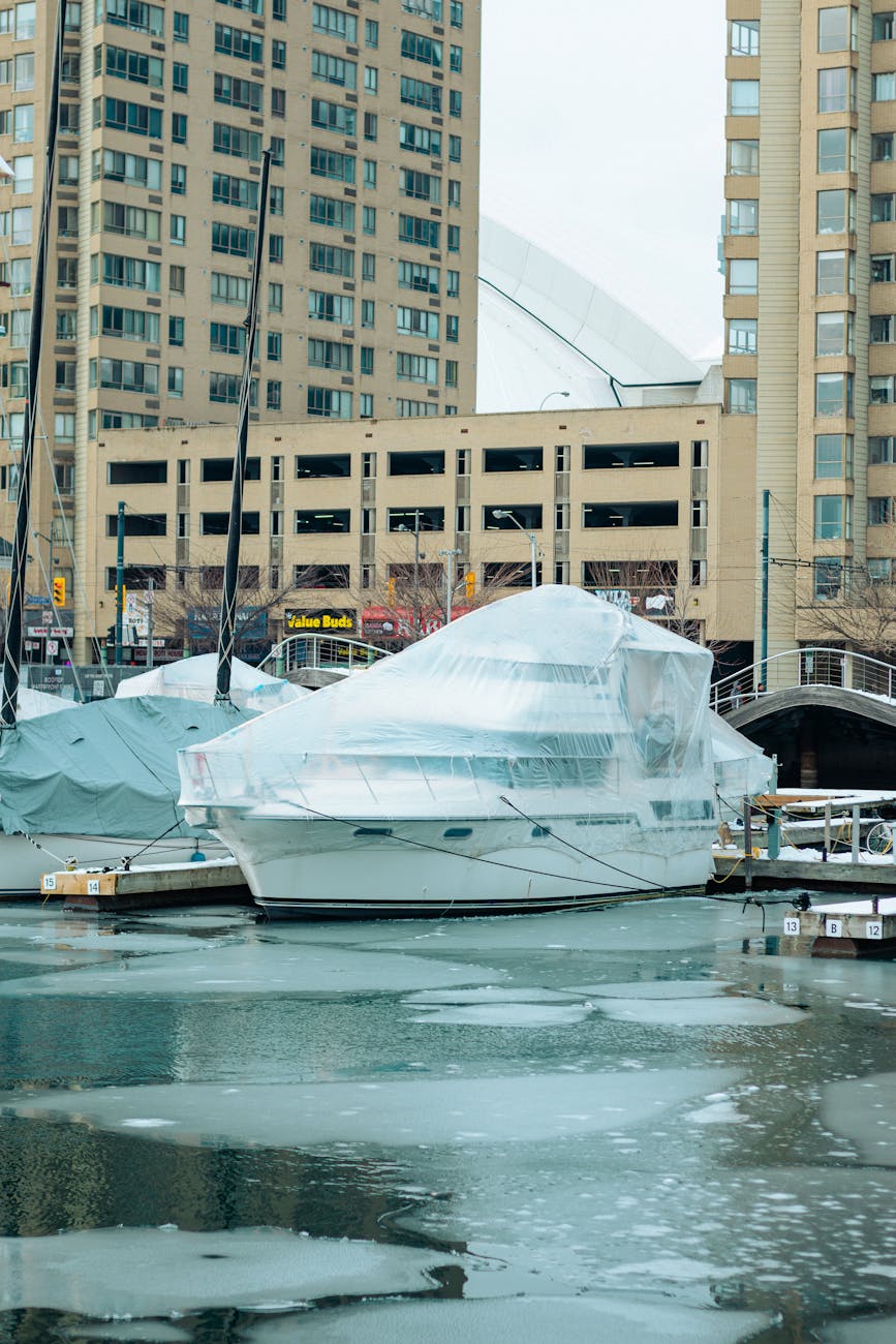 Yacht wrapped up in plastic tenting showing yacht care in a colder climate. 