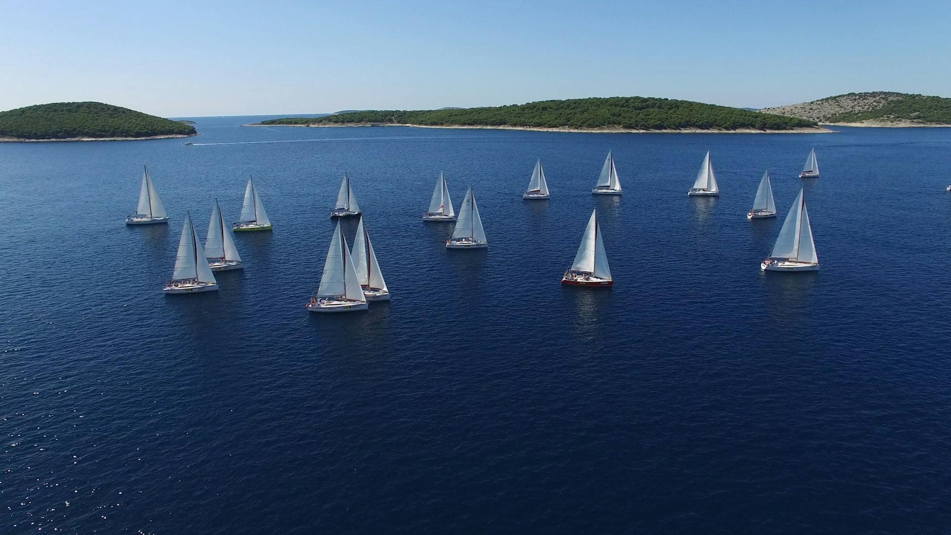 Yachts cruising in a warm weather climate. 