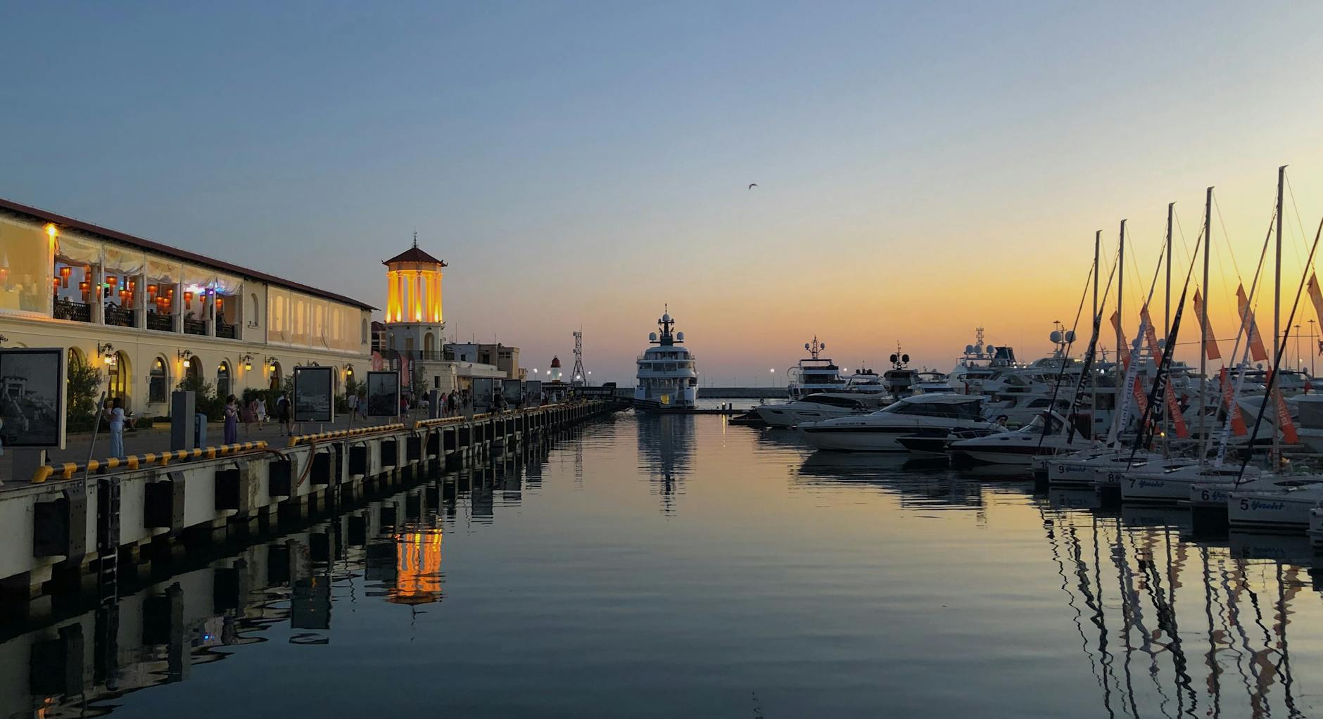Yacht care in a hot climate. Still water on a summers evening in a marina. 
