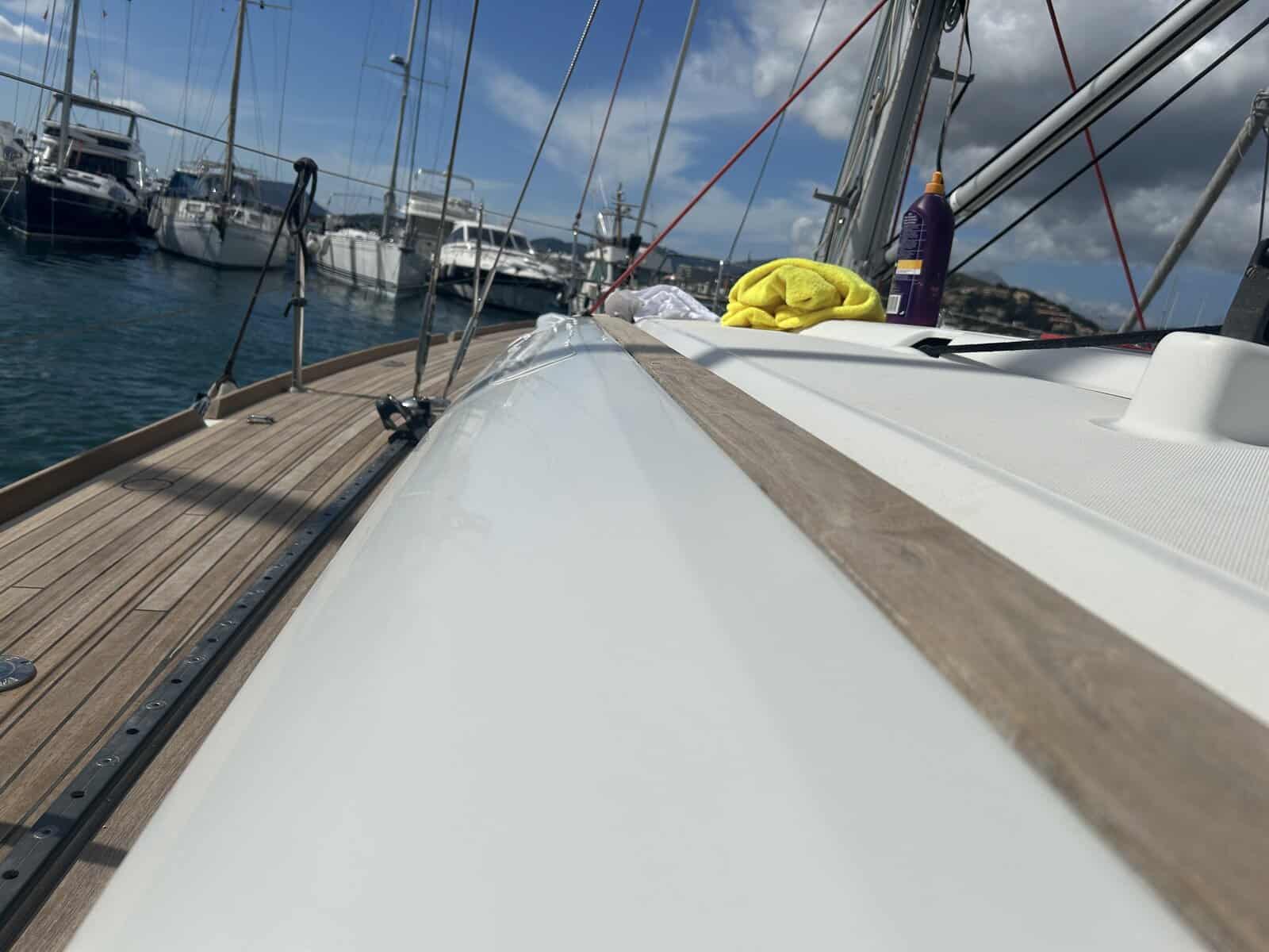Polished gel coat on a sailing yacht with white gelcoat.