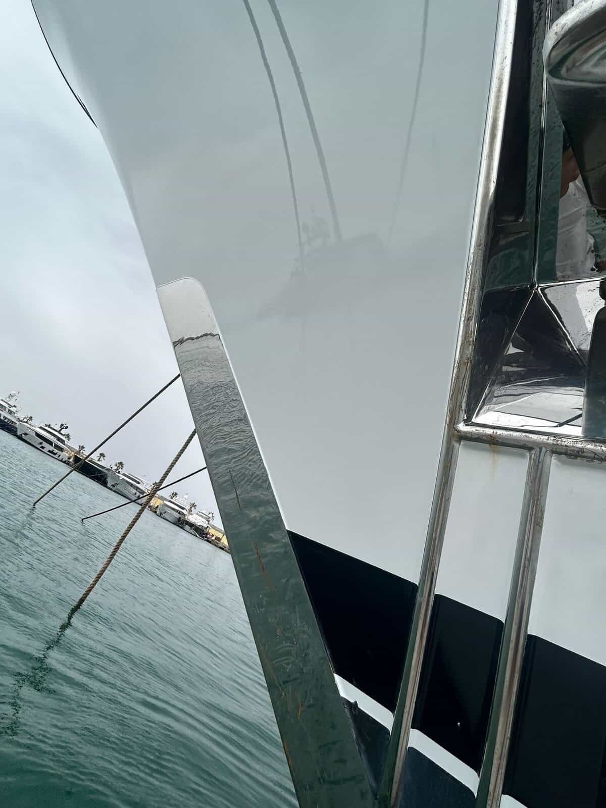 Yacht paint application complete on a yachts hull near anchor pocket. 