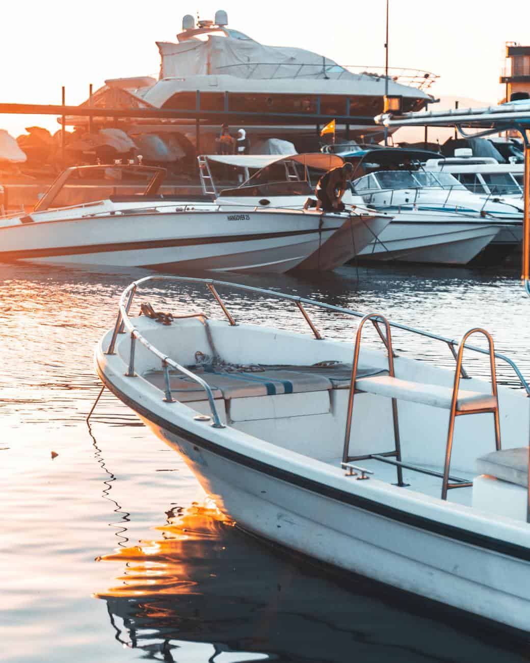 boats and yachts in habour at sunset
