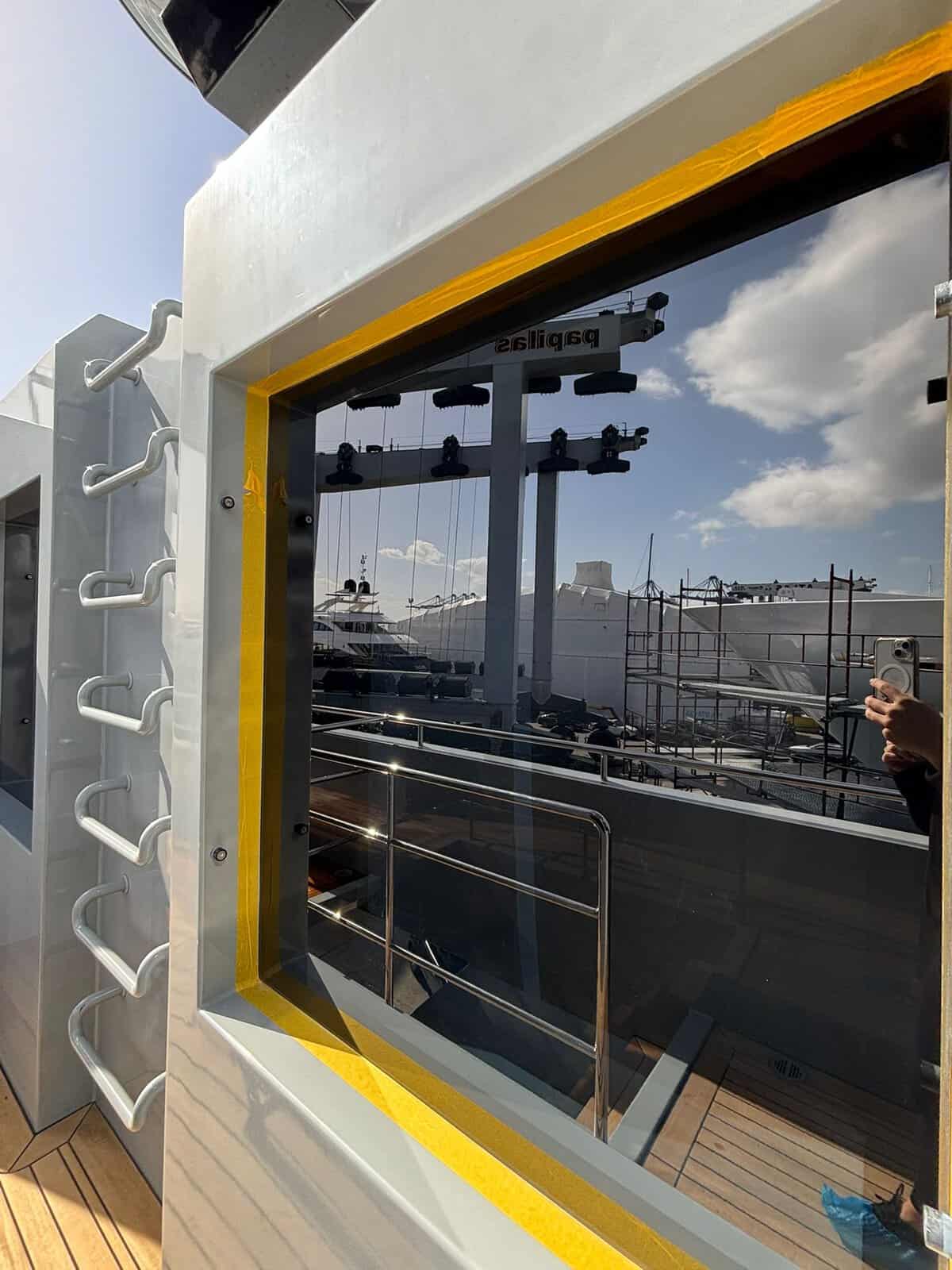 Clean yacht window with water spots removed. 
