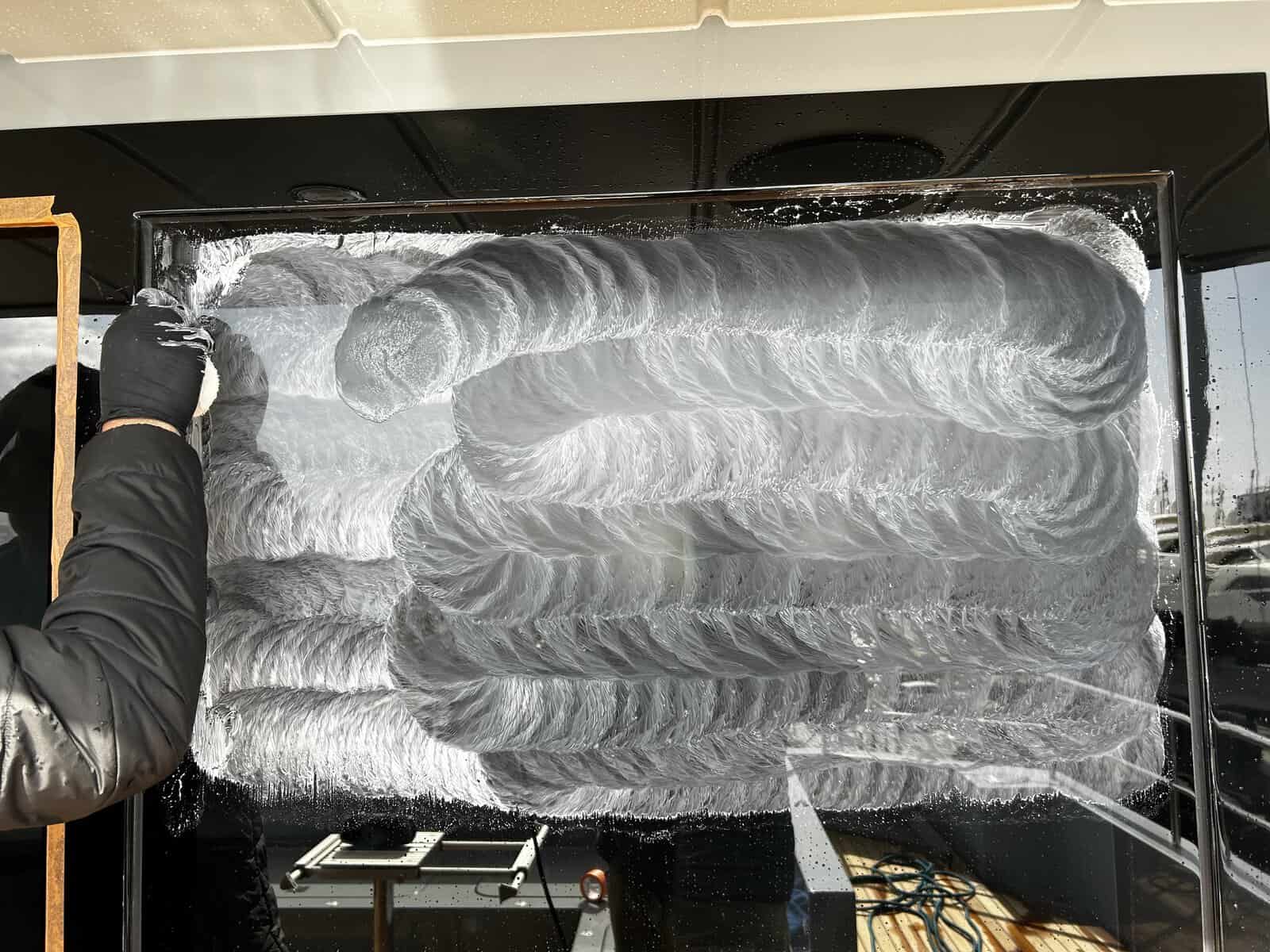 Remove water spots from yacht window using a white calcium remover. 