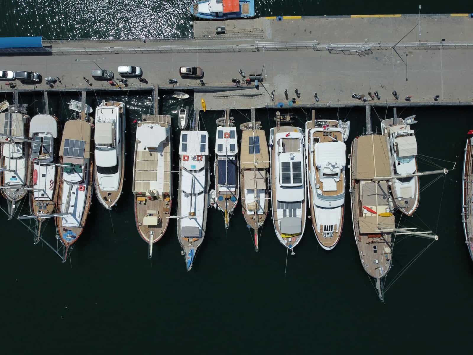 drone shot of yachts docked at the marina. 