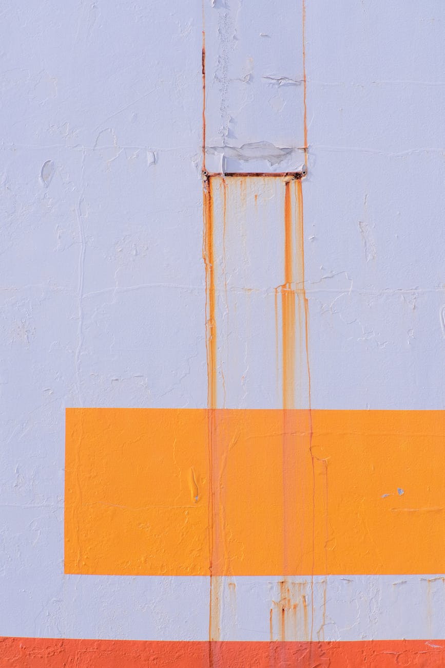 White paint with rust stains driping down the paint. 