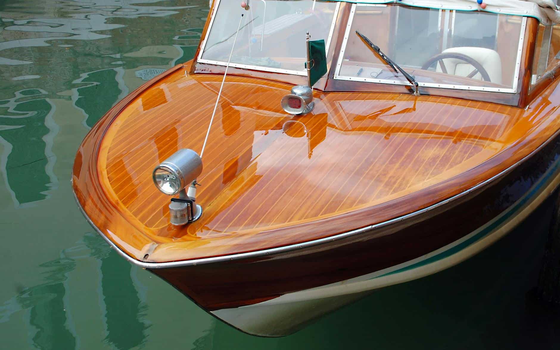 Marine varnish on a small wooden speed boat. 