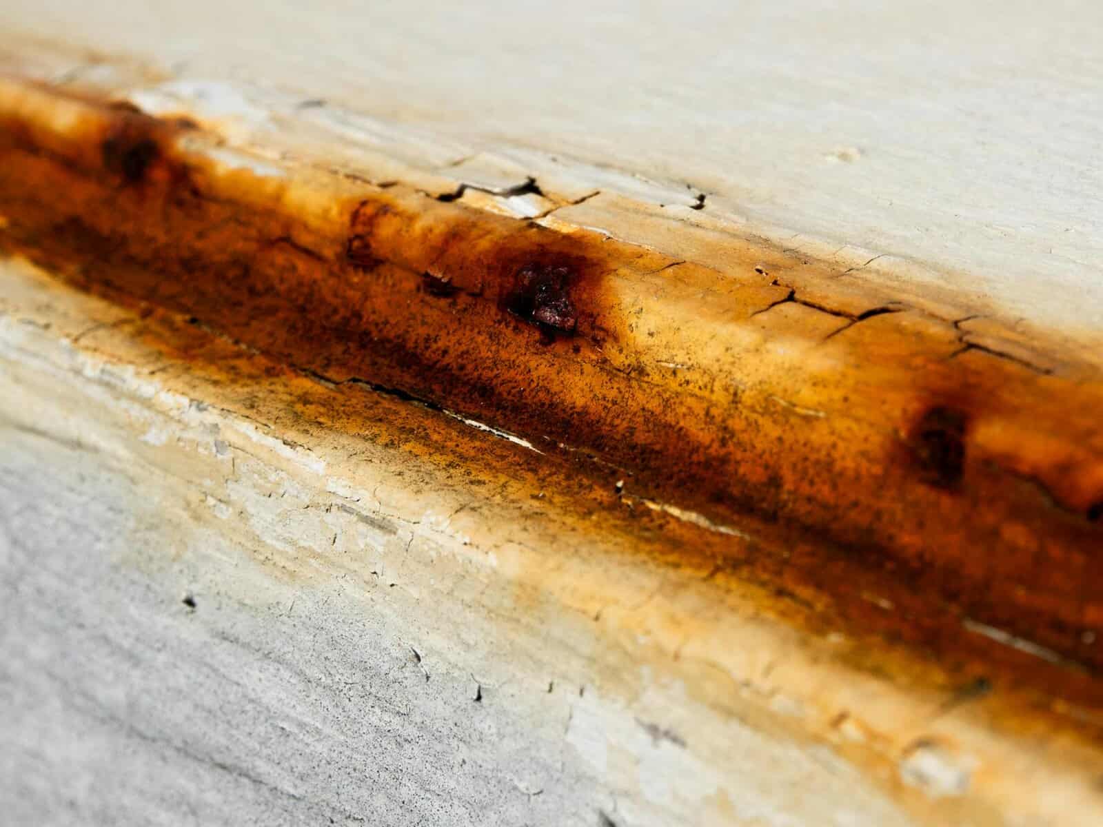 close up of rusty surface with cracks show the need of rust stain removing. 