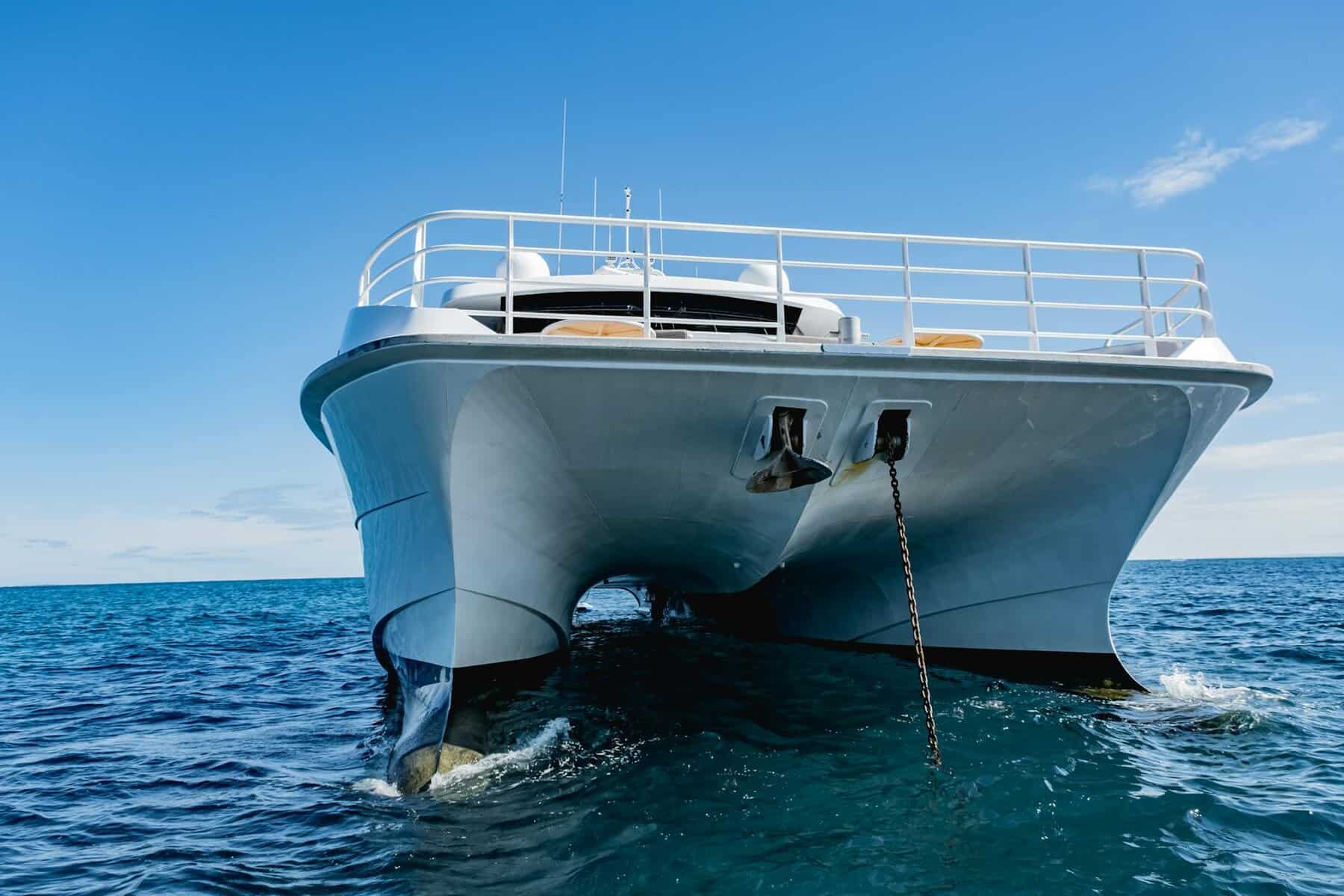 low angle shot of yacht in an ocean showing clean hull and no black streaks. 