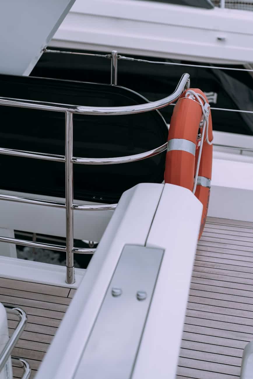 life bouy on a yacht tied to the stainless railing. 