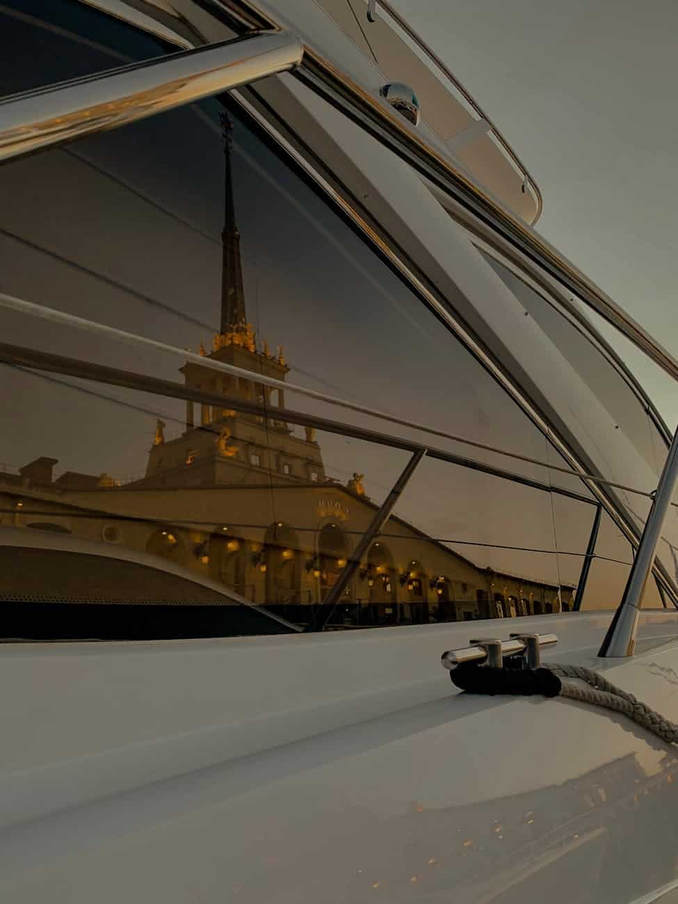 view of an illuminated building from a boat window. Showing how clean the yacht window is. 