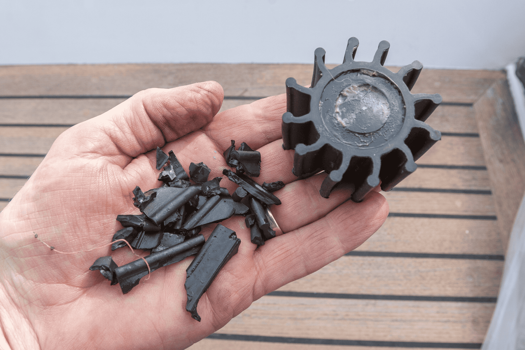 Boat impeller on a hand. With broken vanes from previous pump. 