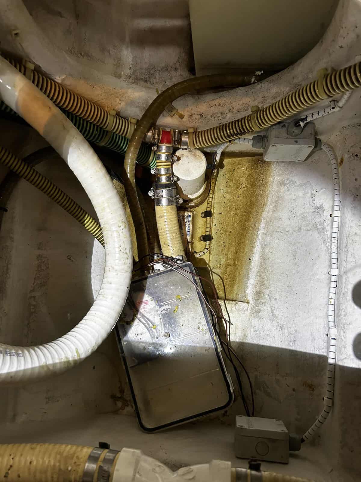 Dirty bilge on a yacht showing need for bilge cleaning 