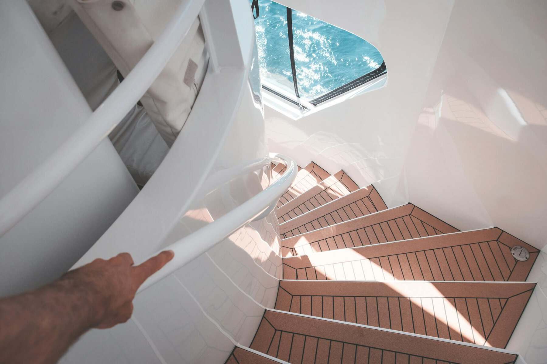 Synthetic teak deck staircase on a yacht.