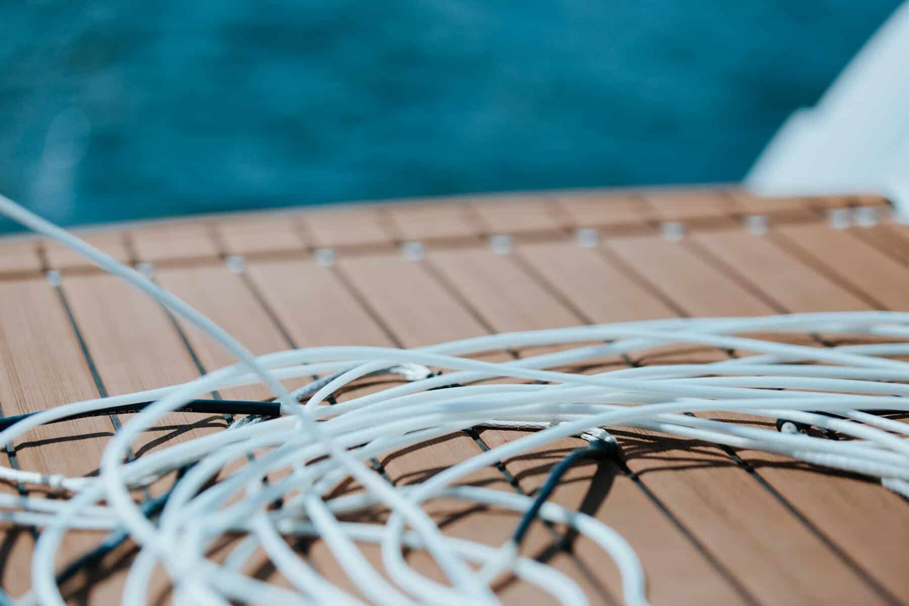 White water-sports tow line sat on a synthetic teak deck. 