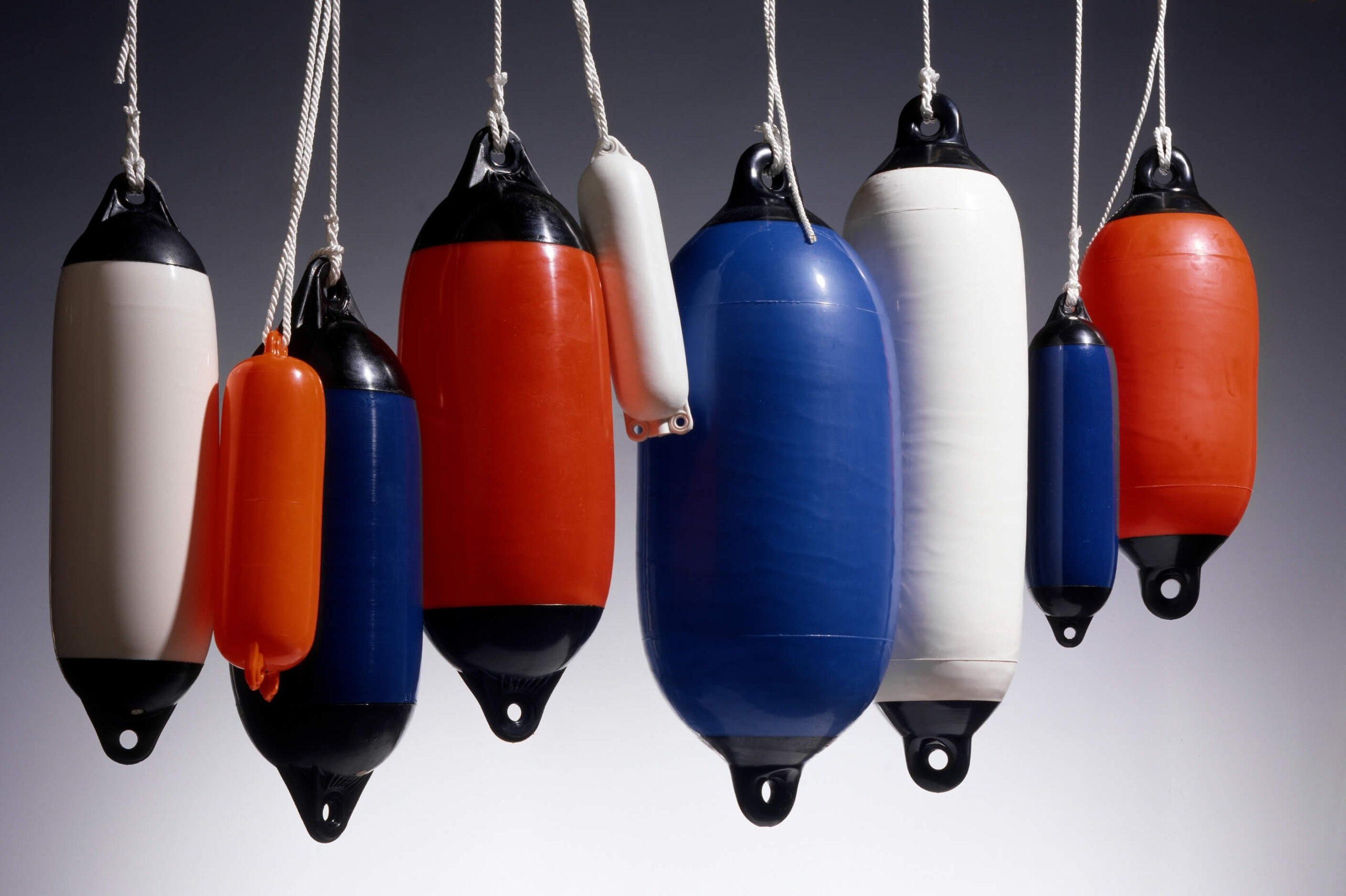 Fenders assortment hanging with a white background. 