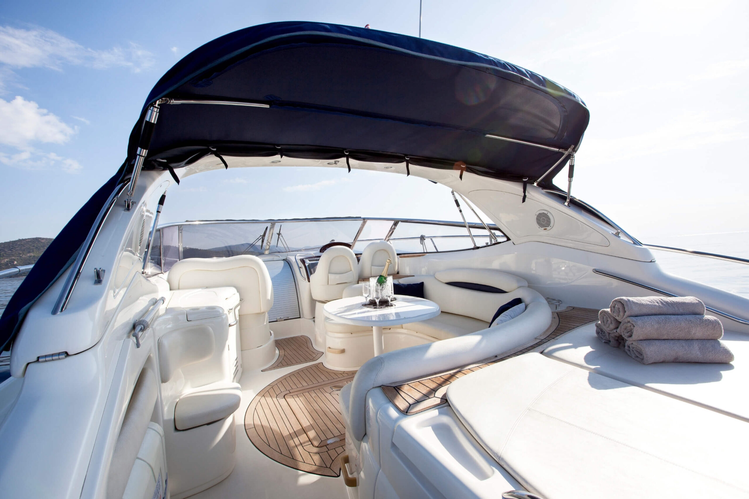 Clean white boat seats on an open top power boat. 