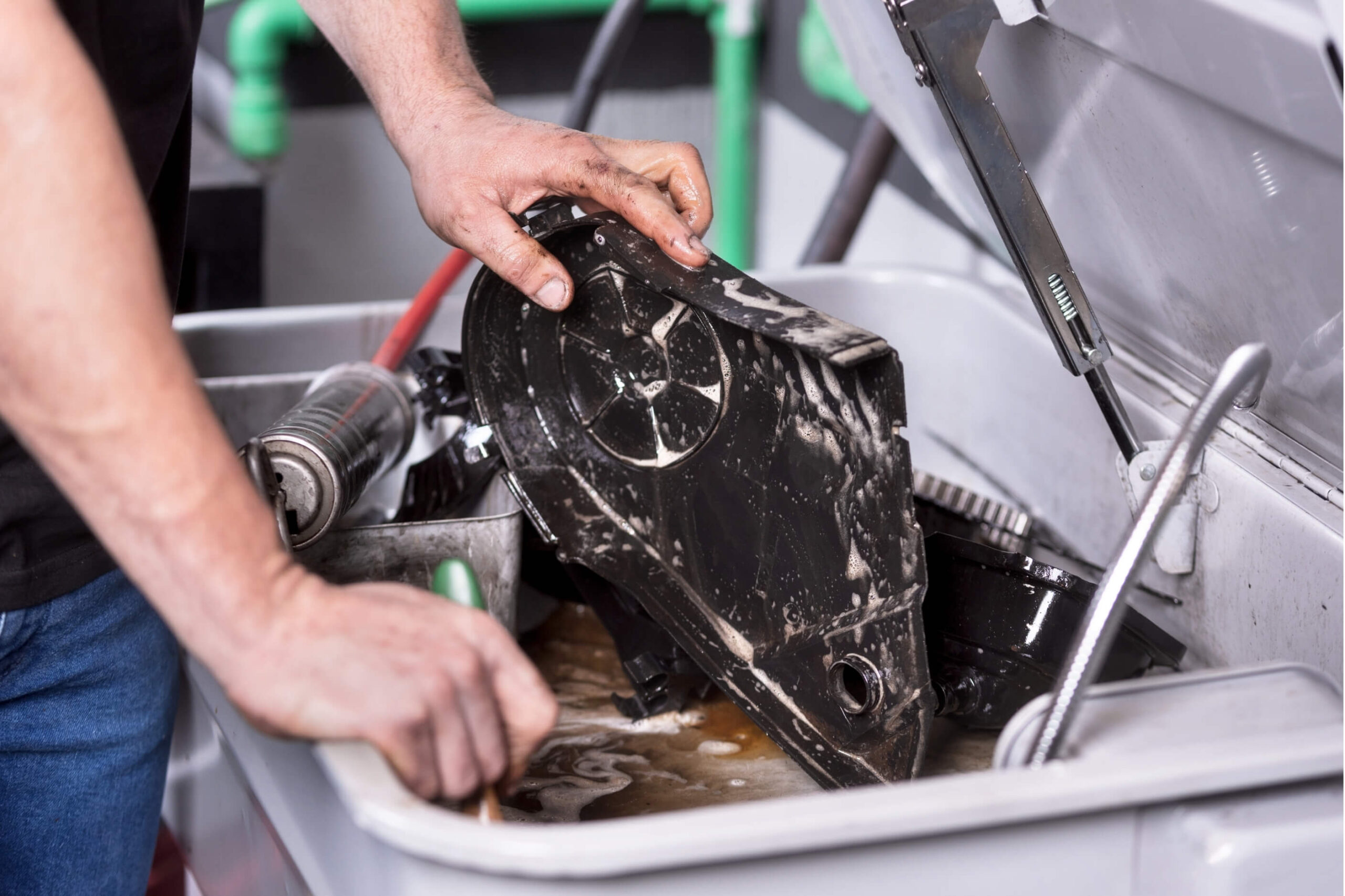 engine parts being degreased. 