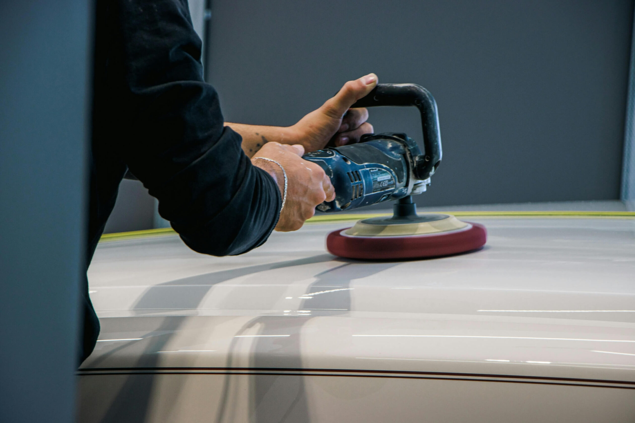 Rotary boat polishing machine being used on gel coat. 