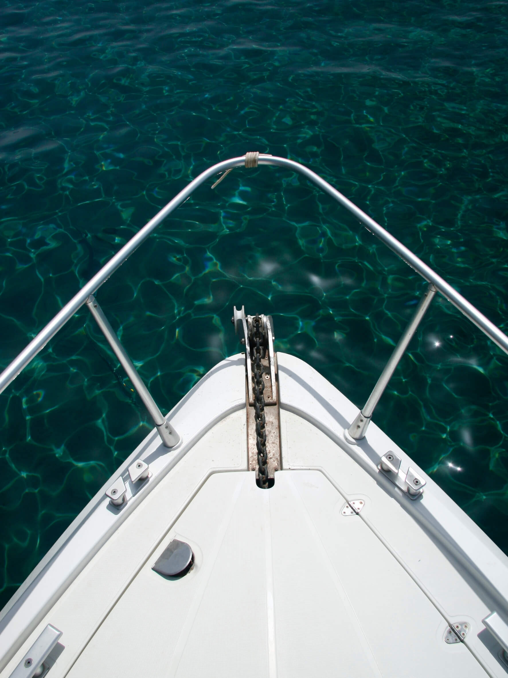 Yacht anchored at sea with glossy gel coat.